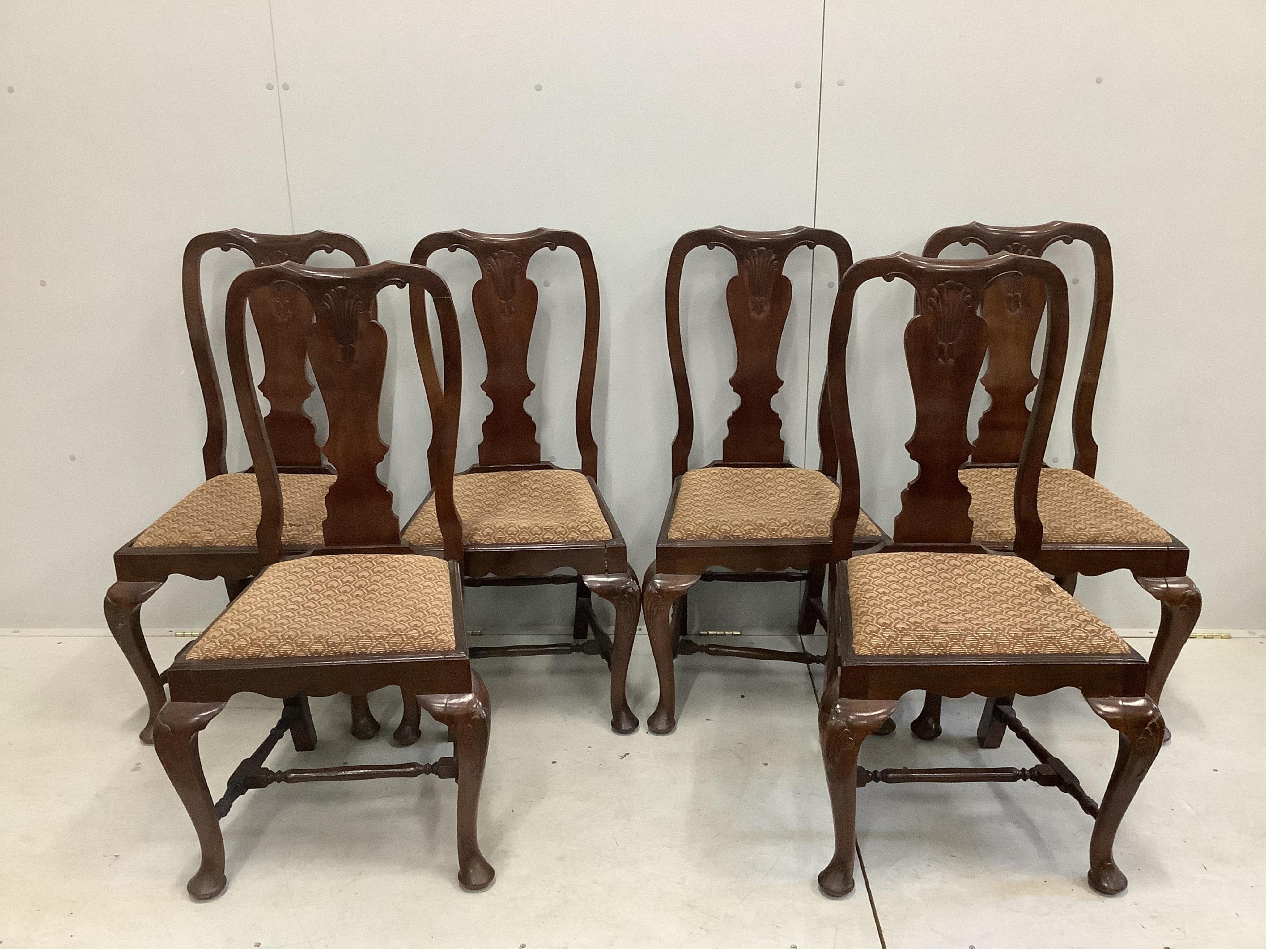 A 1930's walnut extending dining table, 182cm extended, height 106cm and a set of six Queen Anne Revival dining chairs. Condition - fair to good